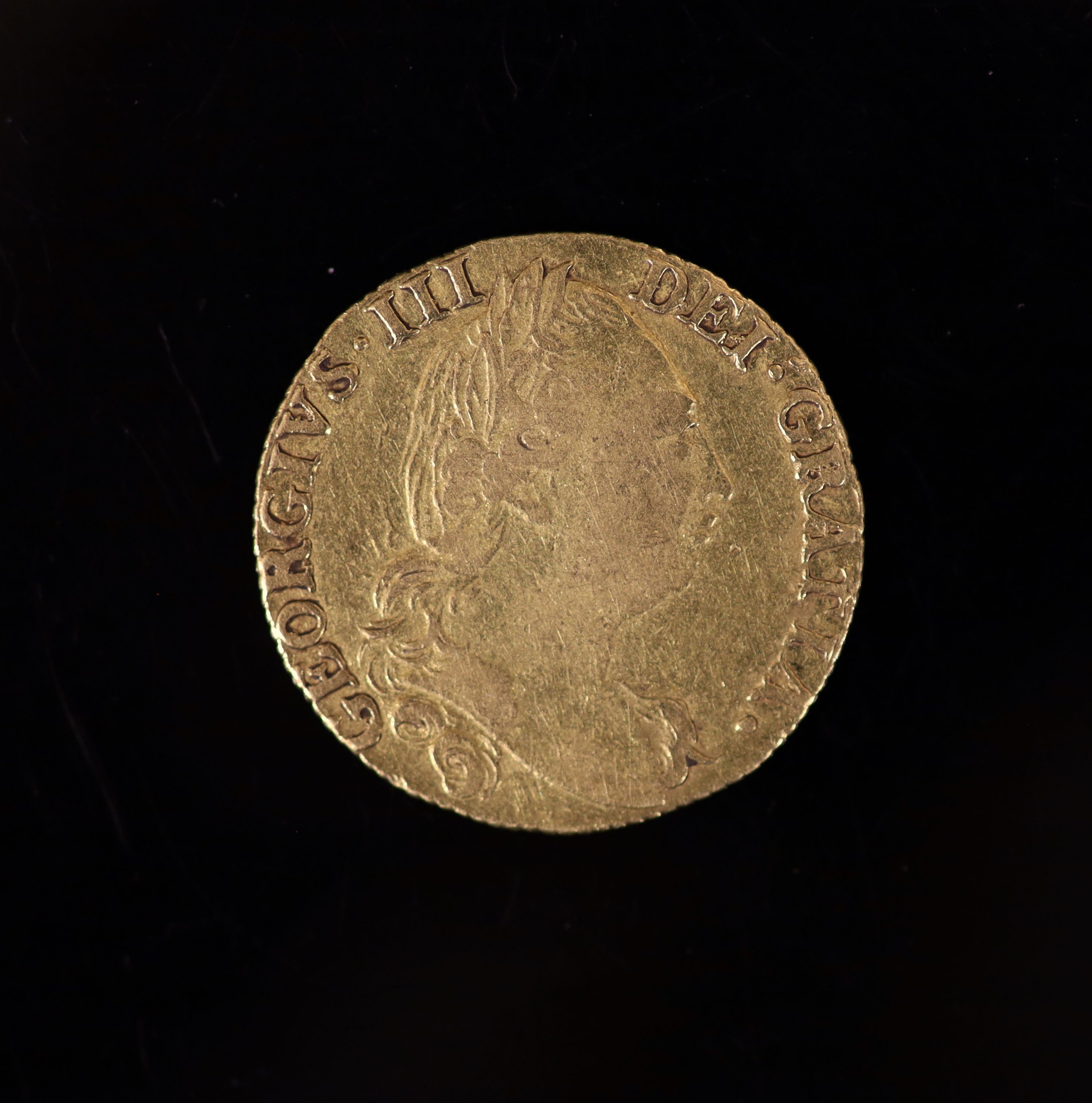 A George III gold guinea 1779, fourth laur. head r., rev. crowned shield of arms (S.3728), AVF